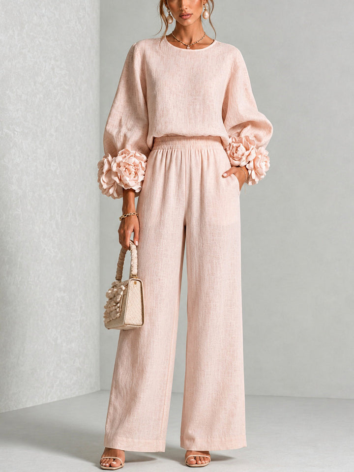 Rosalie Zweiteiler in Rosa mit Blüten-Manschetten und weiter Hose