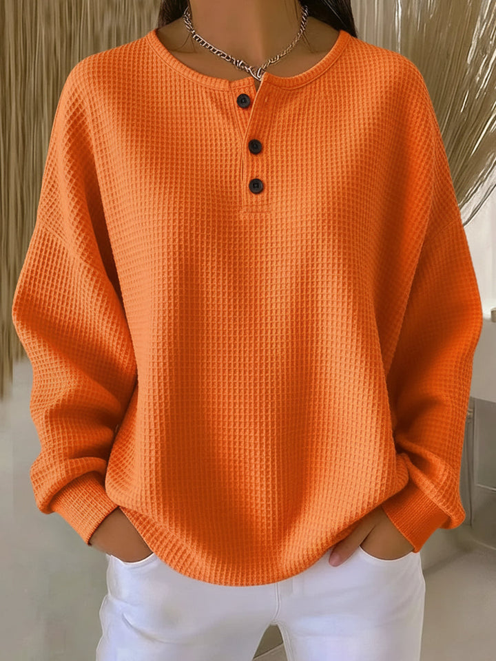 Mirabel Sweatshirt mit Henley-Ausschnitt in Orange